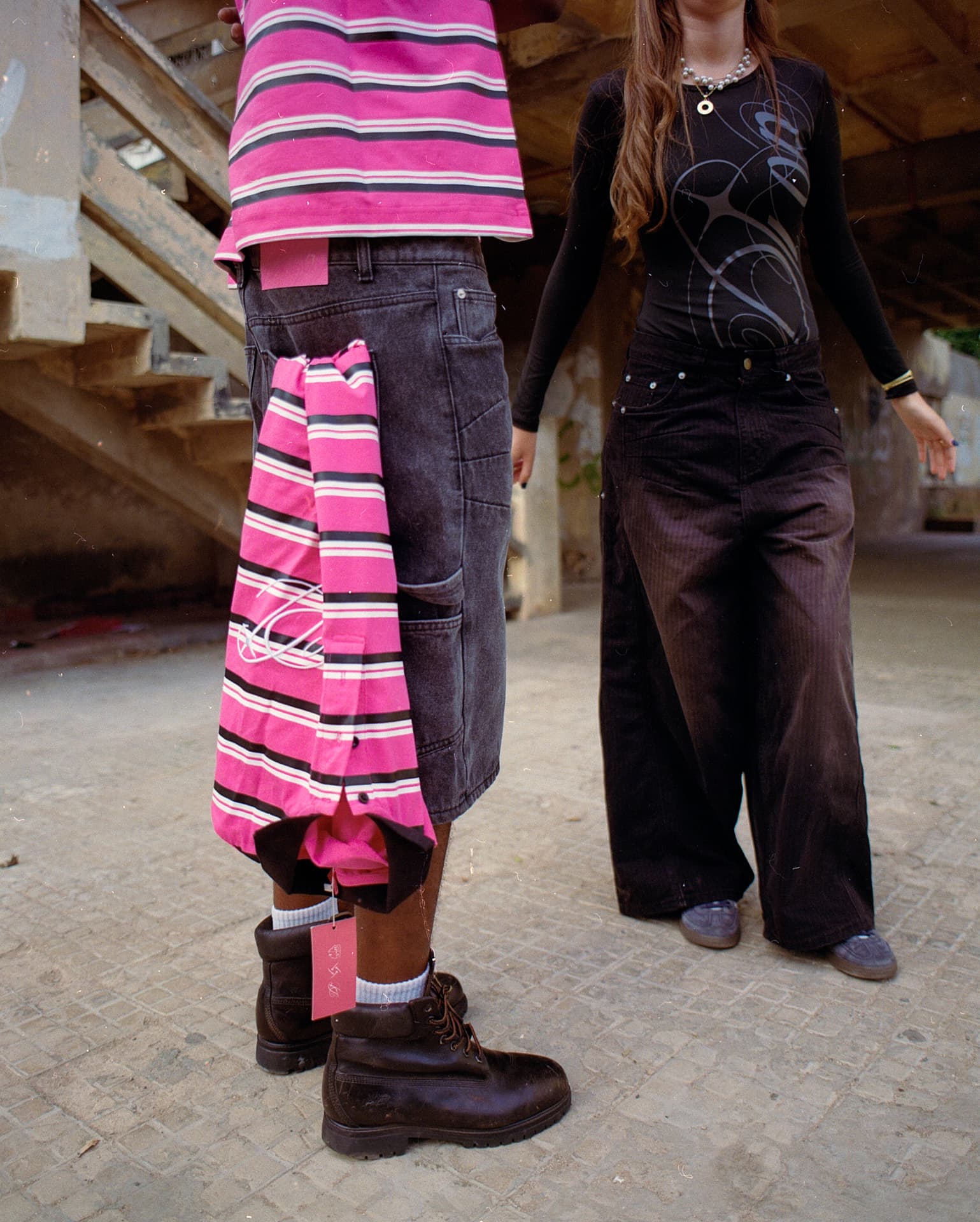 Detail crop of a DROP striped shirt, denim and boots