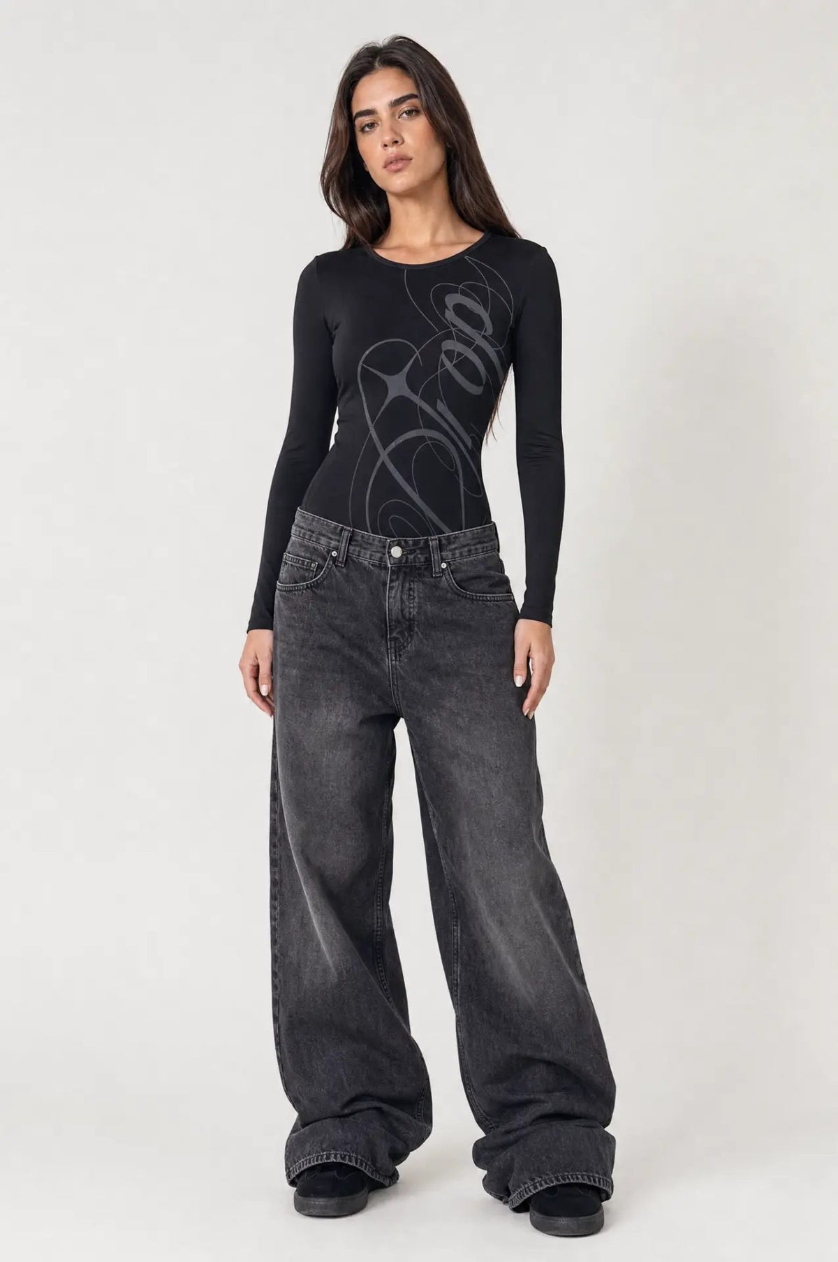 Nikita Bodysuit worn by model, front full-length view