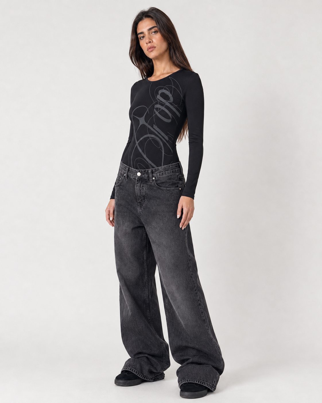 Nikita Bodysuit worn by model, full-length angled front view