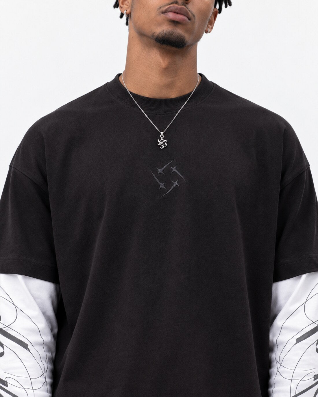 Heritage Long Sleeve — chest logo embroidery detail