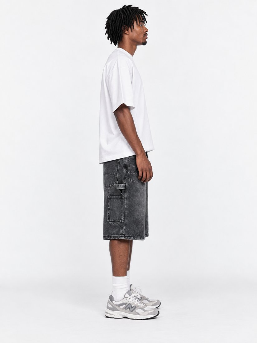 Exhibit 001 Jorts — side profile on model showing utility pocket
