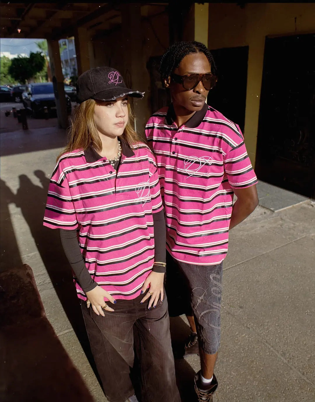 Two models on a Casablanca street in DROP striped polos